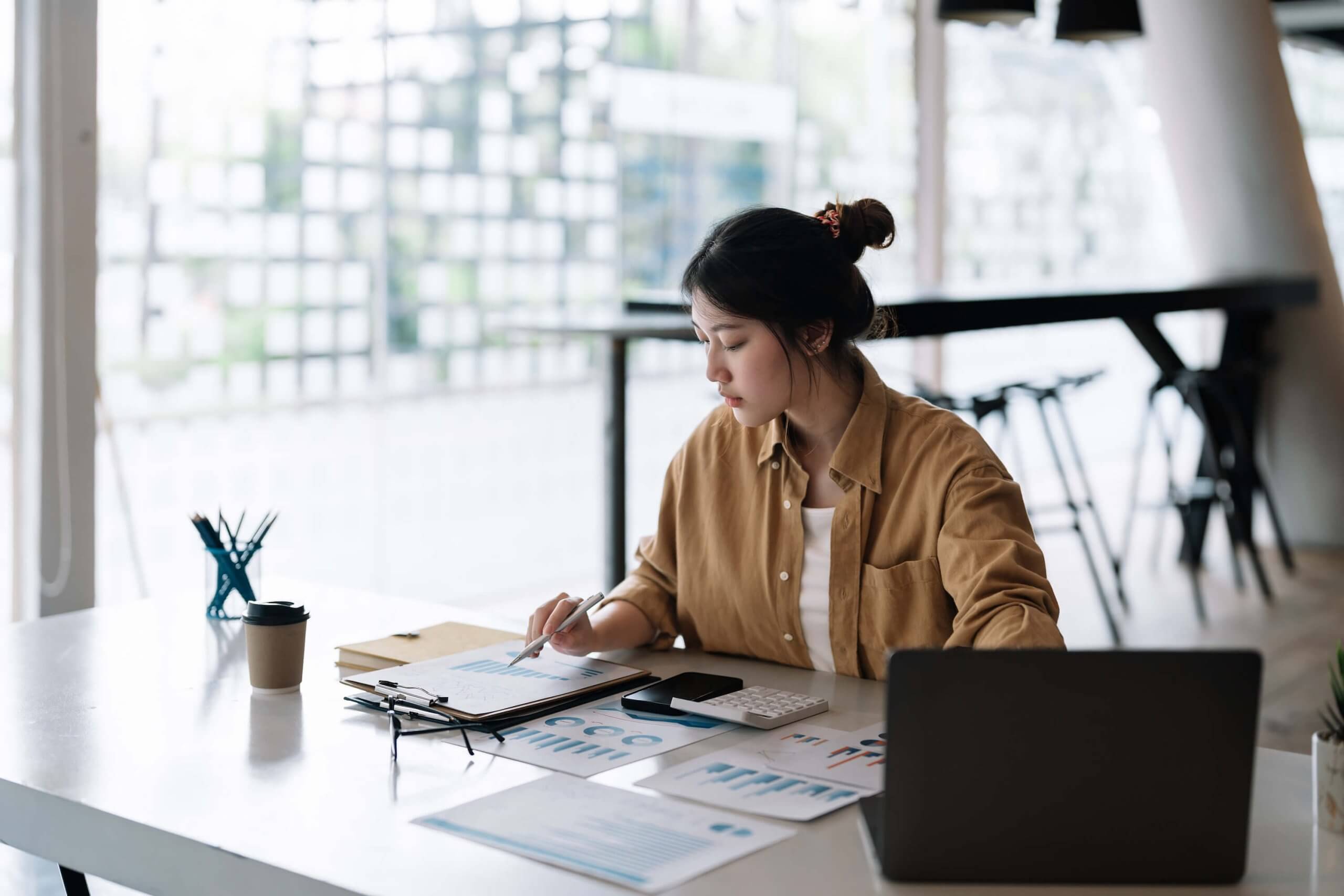 The Top 10 Mistakes To Avoid When Buying A Home In Toronto 1 Accountant Business Woman Using Calculator And Com 2022 08 18 19 23 00 Utc 1 Scaled