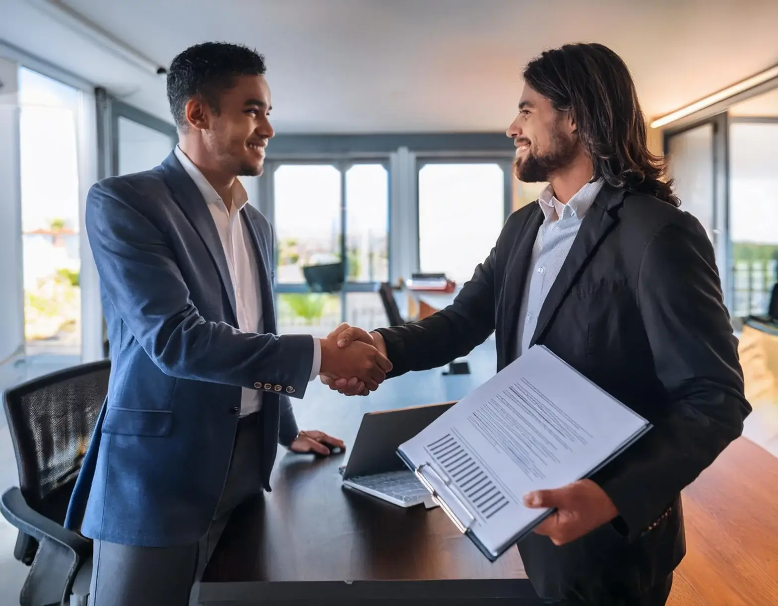 Commercial Property Closing Costs 1 Firefly A Handshake Between Two Business Professionals After Successfully Negotiating Closing Costs