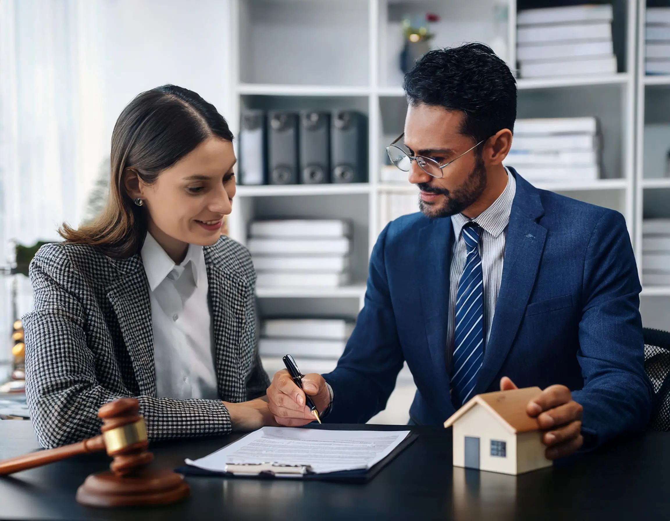 Are Property Taxes Included In Closing Costs 2 Are Property Taxes Included In Closing Costs 1 Firefly A Real Estate Lawyer Preparing The Deed Of Sale In Their Office With A Client Reviewing The